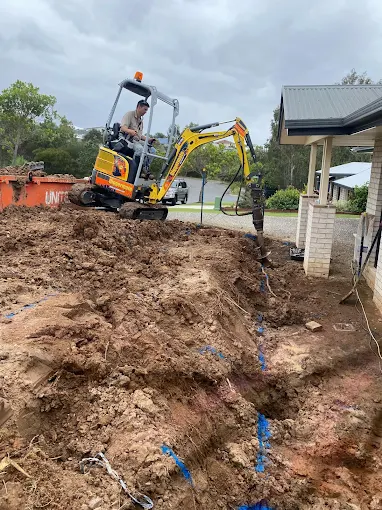 Mini excavator preparing a residential site